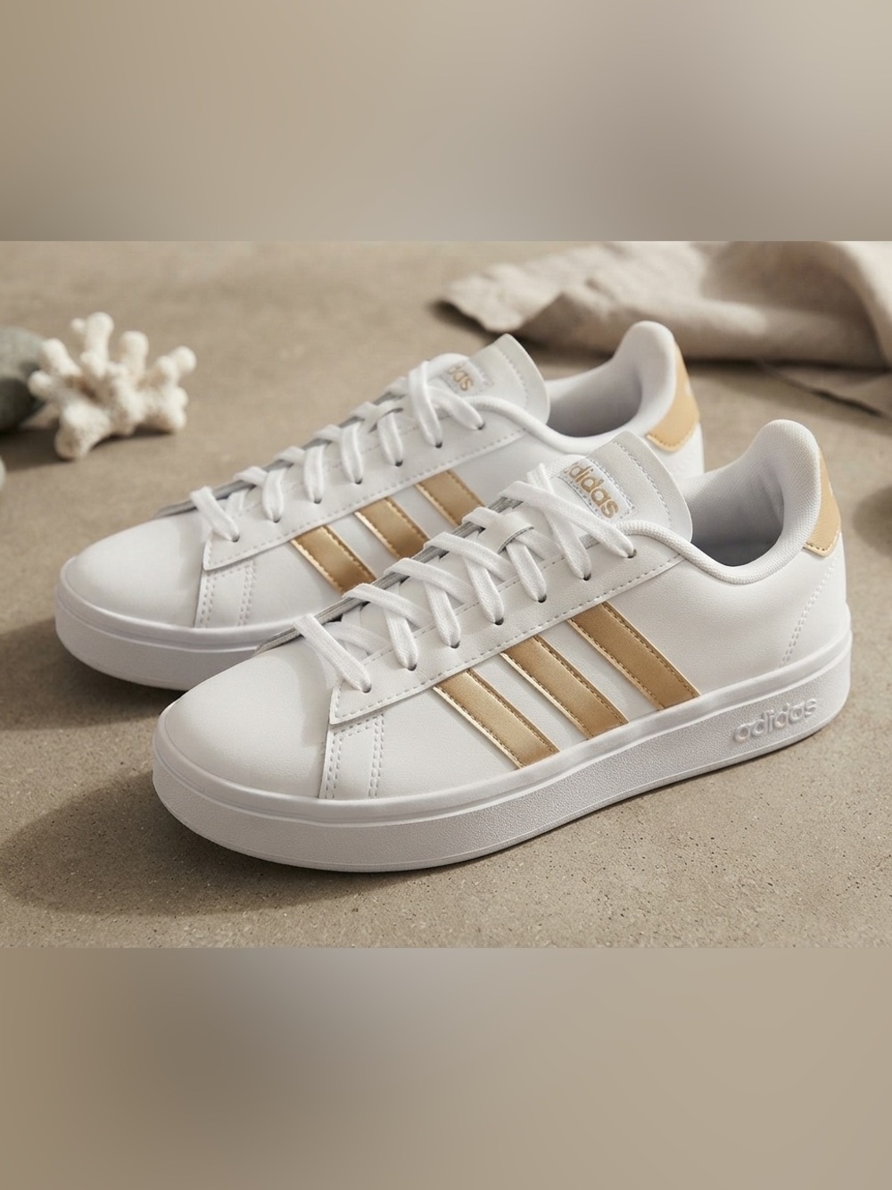 adidas White Sneakers with Gold Stripes